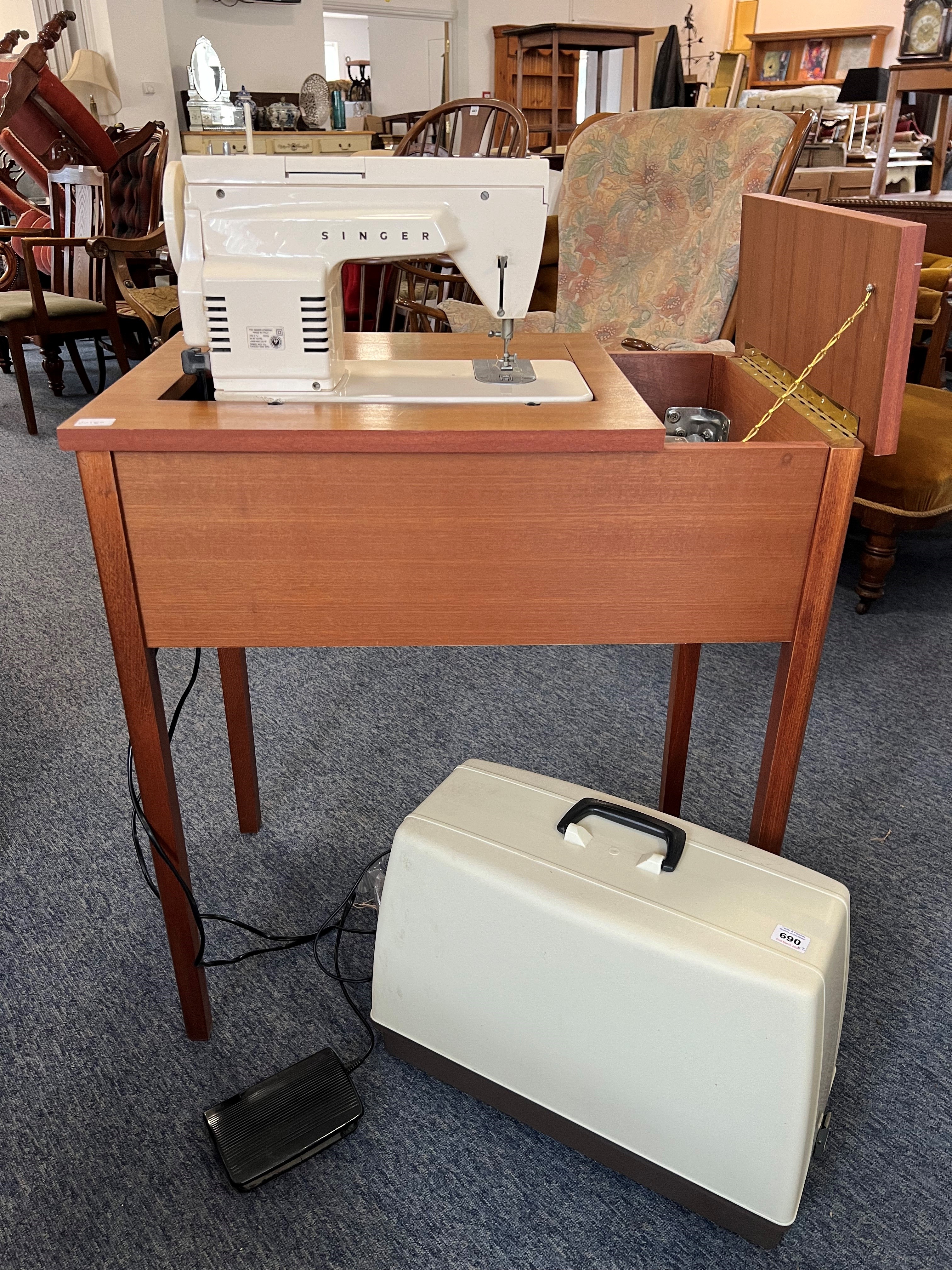 A vintage 1970s Singer 368 Fashion Mate electric sewing machine - fitted into a teak table