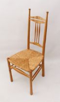 A Cotswold-style turned ash hall chair - late 20th century, with three-slat and spindle back, within