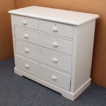 A Victorian white-painted chest of drawers - the moulded top over two short and three long graduated