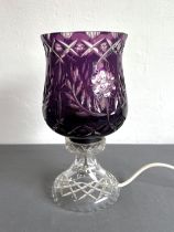 An amethyst cased glass table lamp, possibly Scottish - the tulip shaped shade with floral, diamond,