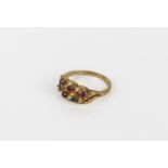 An 18ct yellow gold and multi gem ring - stamped '18CT', the openwork, twist setting with six