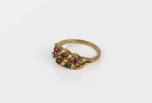 An 18ct yellow gold and multi gem ring - stamped '18CT', the openwork, twist setting with six