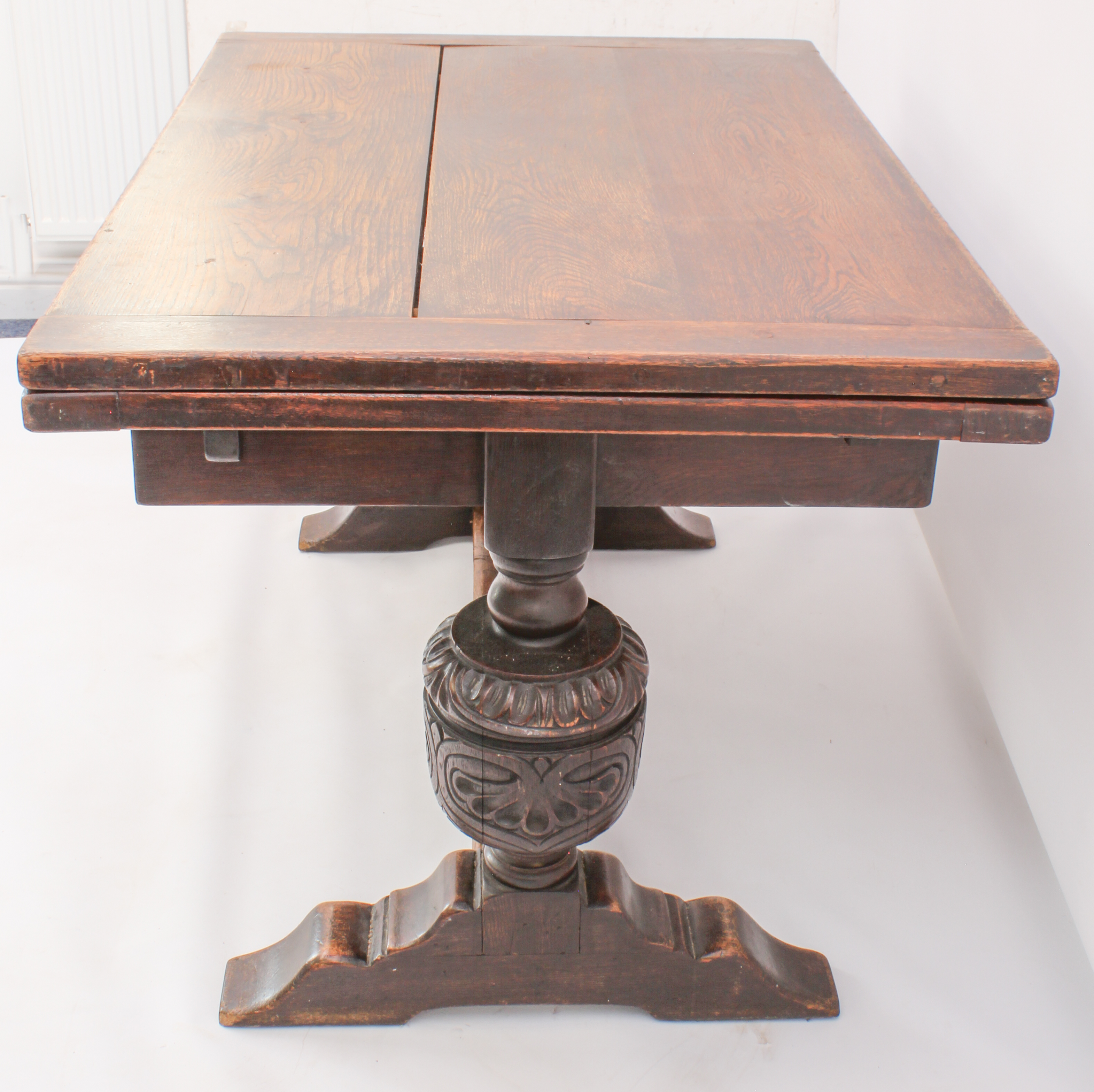 A carved oak extending refectory style dining table - the cleated, rectangular top with a single - Image 3 of 7