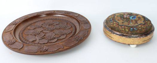 A large Continental turned and carved wooden charger - mid-20th century, carved with flowers and