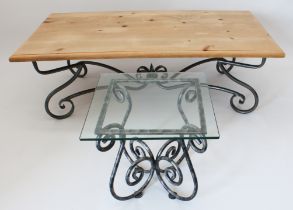 A wrought iron and waxed coffee table - the moulded, rectangular top on a gunmetal painted wrought