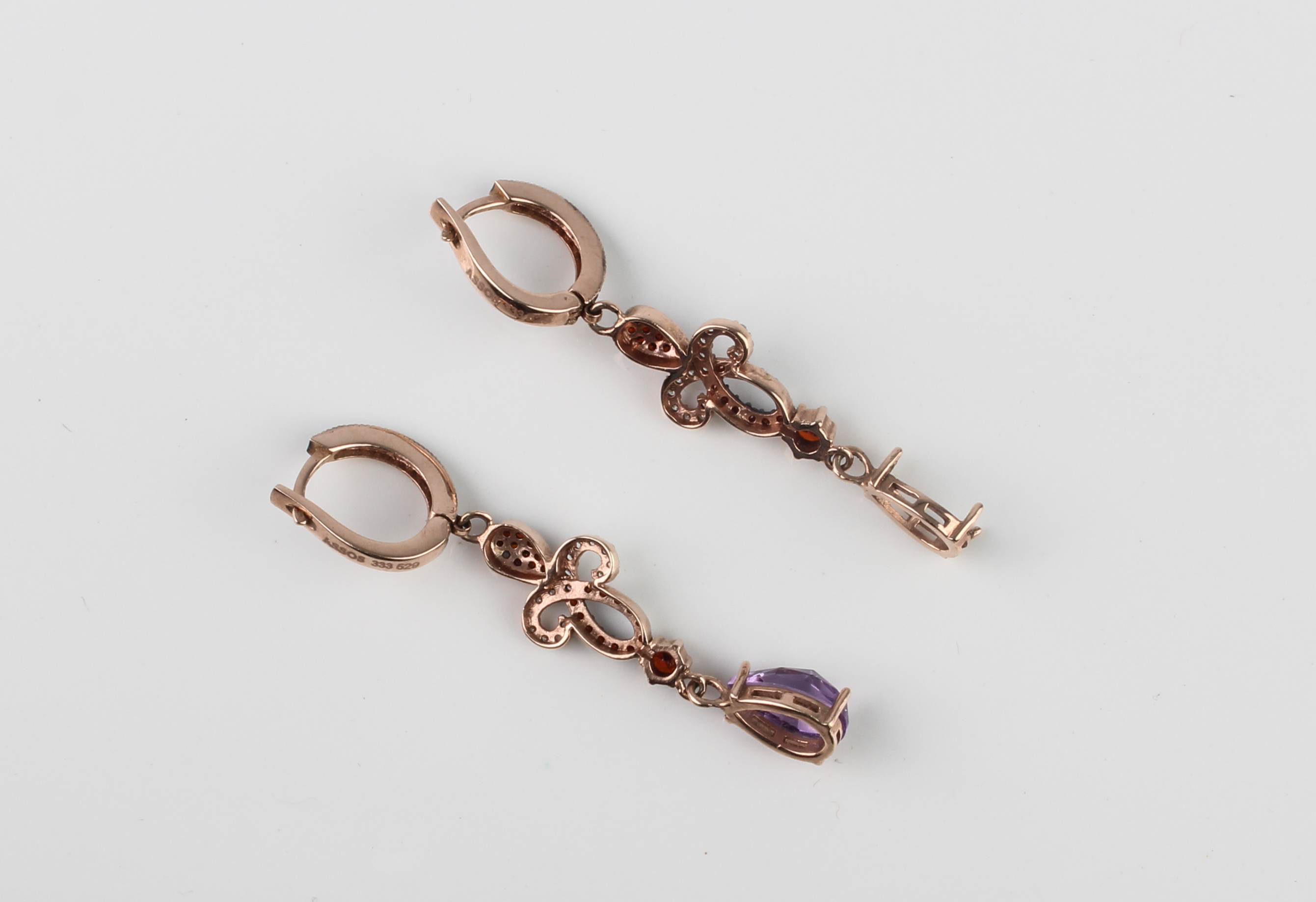 A pair of 8ct rose gold, white stone, amethyst and garnet drop earrings - marked '333', with post - Image 2 of 3