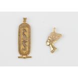 Two Egyptian 18ct yellow gold pendants - one of tablet form with hieroglyphics and a filigree