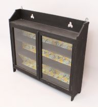 A painted pine glazed wall hanging cabinet - with trefoil pierced shelf top over a pair of glazed