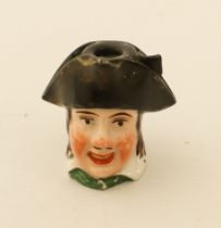 A novelty Victorian porcelain inkwell - in the form of the bust of a young man wearing a tricorn