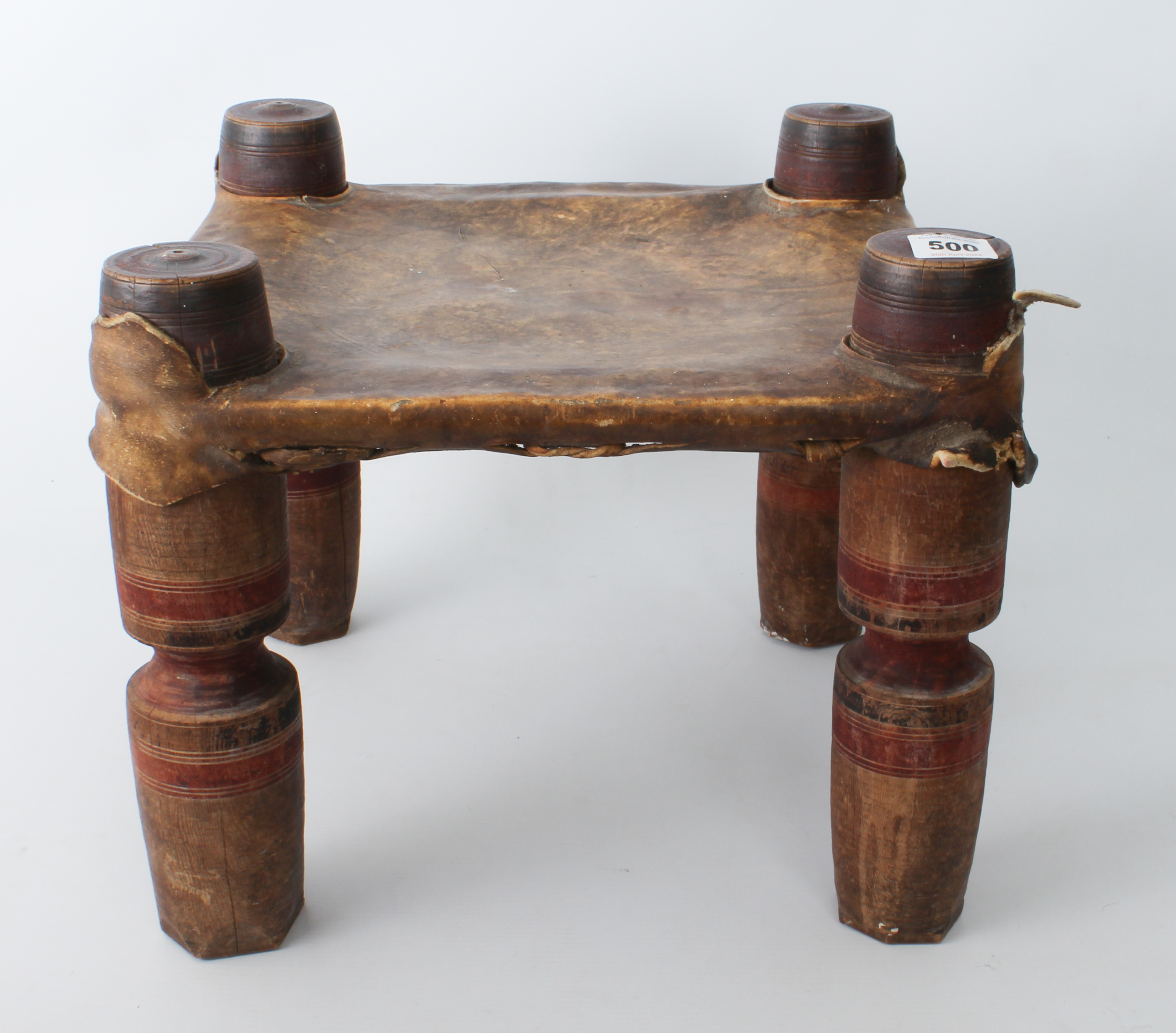 An Indian turned wooden and vellum stool - early to mid-20th century, square, the vellum seat - Image 3 of 4