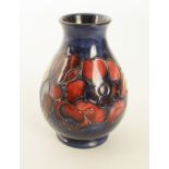 A Moorcroft baluster vase in the 'Anemone' pattern - impressed factory marks and painter's mark '