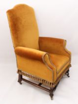A Victorian armchair in Dutch 18th century style  - the high, camel back, scroll arms and seat