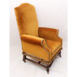 A Victorian armchair in Dutch 18th century style  - the high, camel back, scroll arms and seat