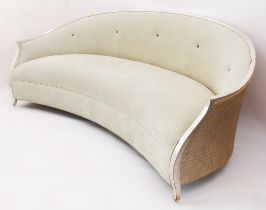 A crescent-shaped silvered giltwood, caned and suede settee by Christopher Guy - reputedly