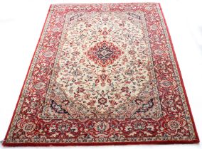 A Kashan style machine made wool rug - 178 x 121 cm.