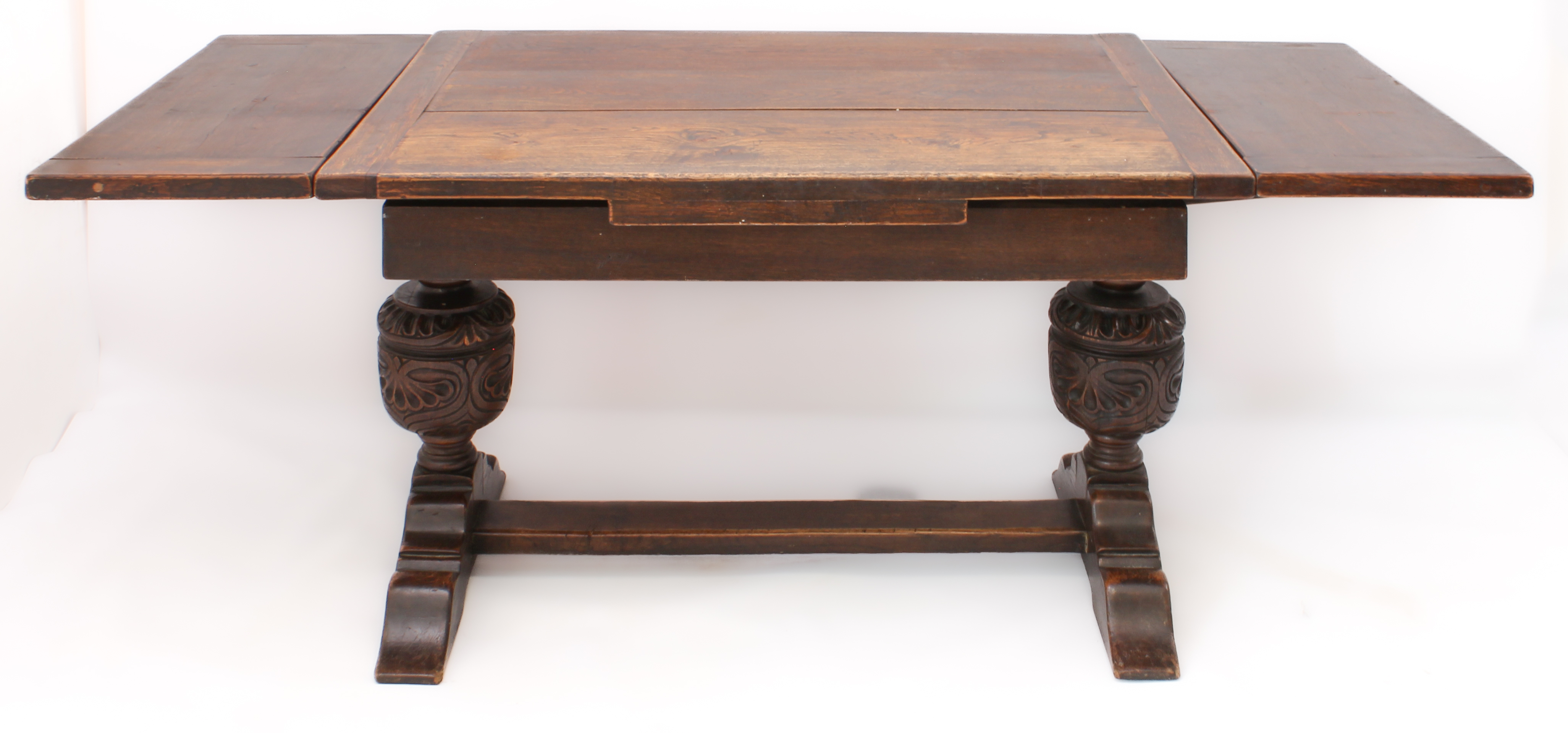 A carved oak extending refectory style dining table - the cleated, rectangular top with a single - Image 4 of 7