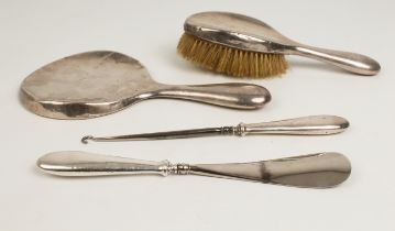 A William Neale & Son (Birmingham 1918) 4-piece dressing-table set: 1. a silver-handled shoe-horn