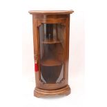 A small glazed walnut stained bowfront corner cabinet - late 20th century, with electric