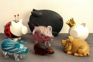 Seven pig ornaments: an Alum Bay Glass, 17.5 cm long; an amber glass pig (unmarked); a marbled