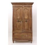 An Indian panelled hardwood cupboard - mid-20th century, probably teak, the flared, moulded