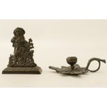 A Regency bronze miniature doorstop - probably a mantel ornament, depicting a young man and his