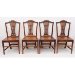 A set of four George III provincial oak dining chairs - with pierced vase splats over solid seats,