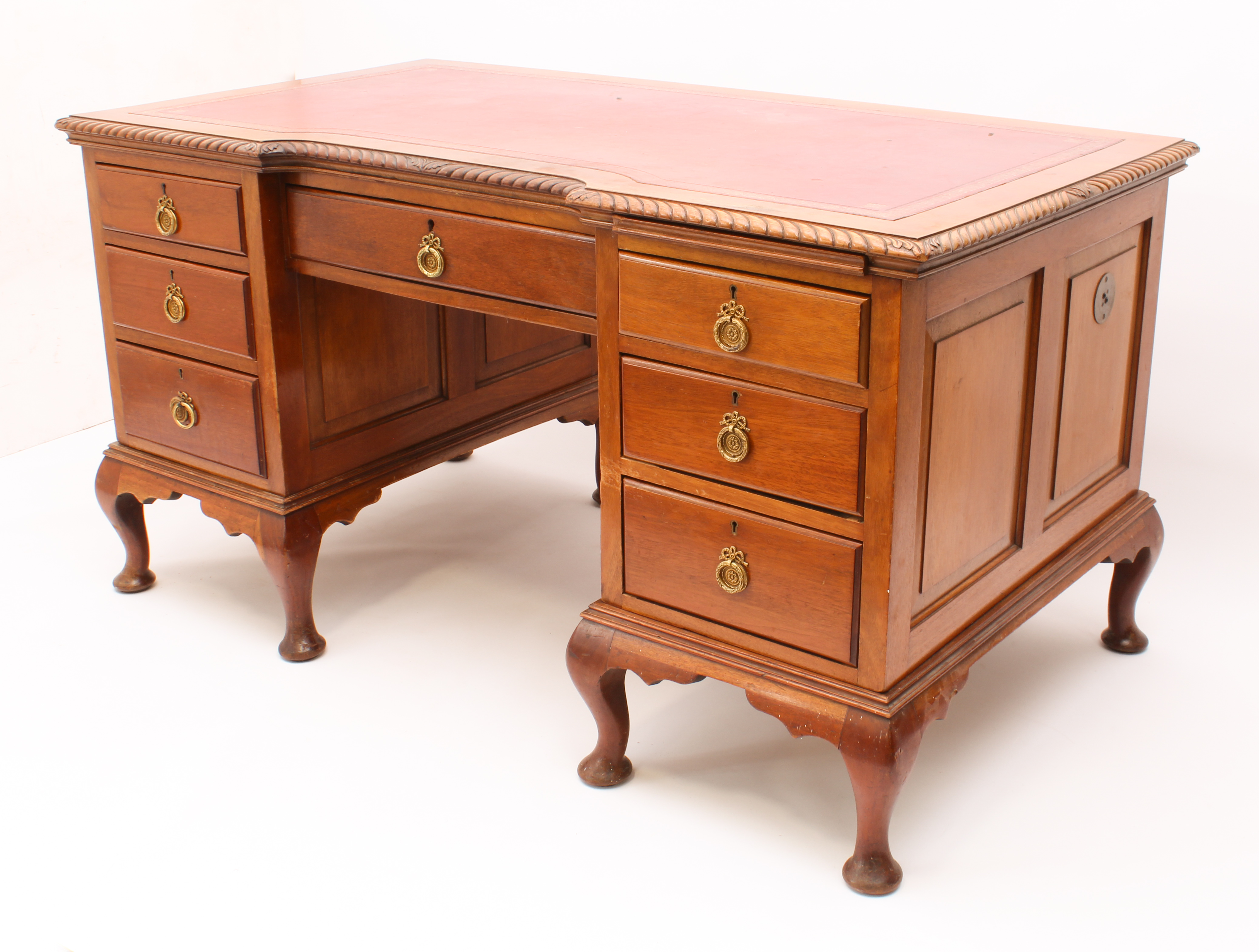 A 1920s Georgian-style mahogany inverted breakfront double pedestal desk - the moulded top with