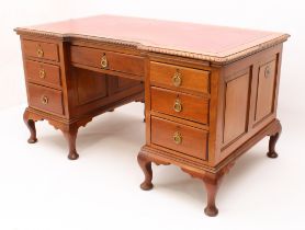 A 1920s Georgian-style mahogany inverted breakfront double pedestal desk - the moulded top with