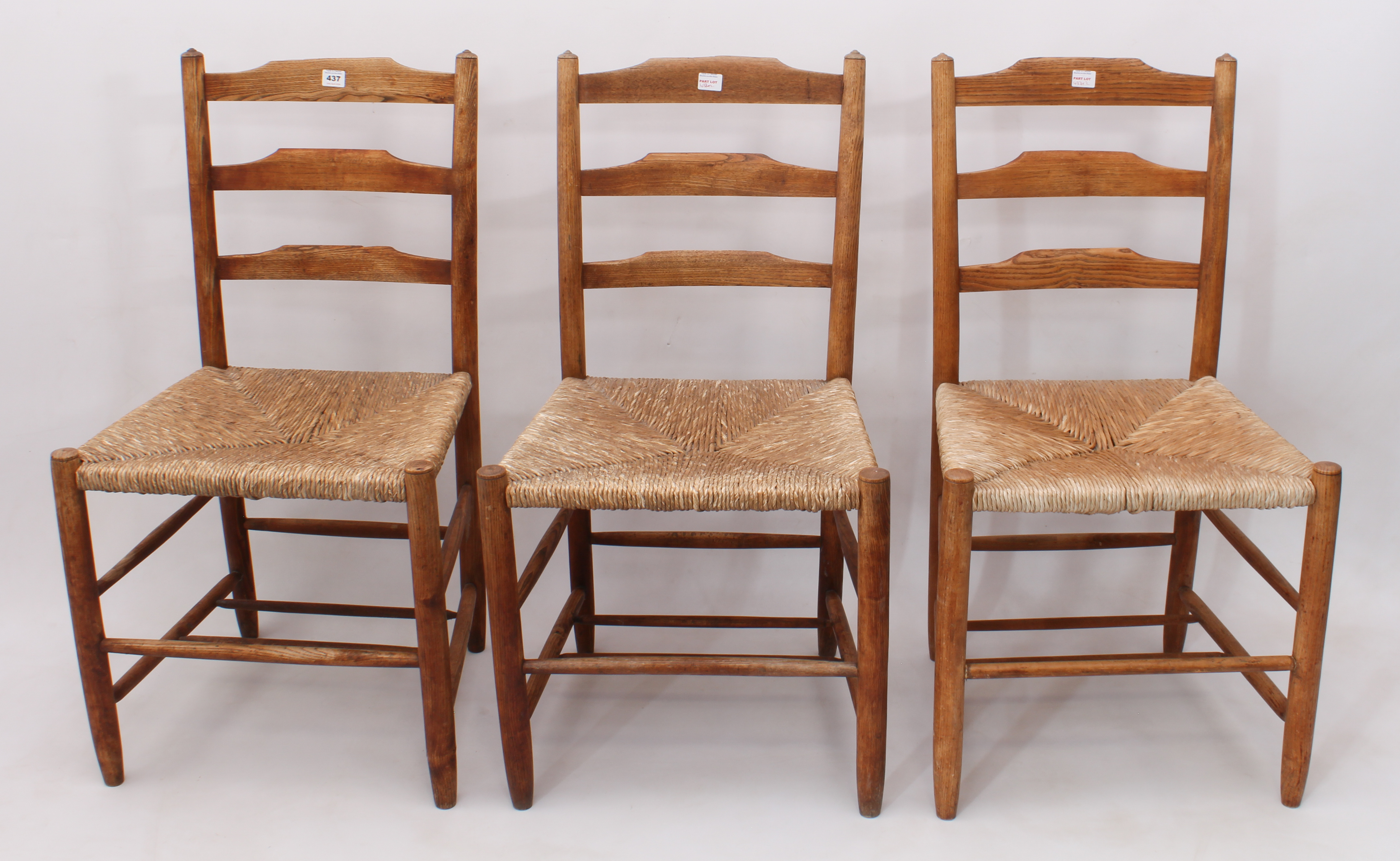 Three Cotswold School 19th century ash and elm ladderback chairs in the style of Philip Clissett -