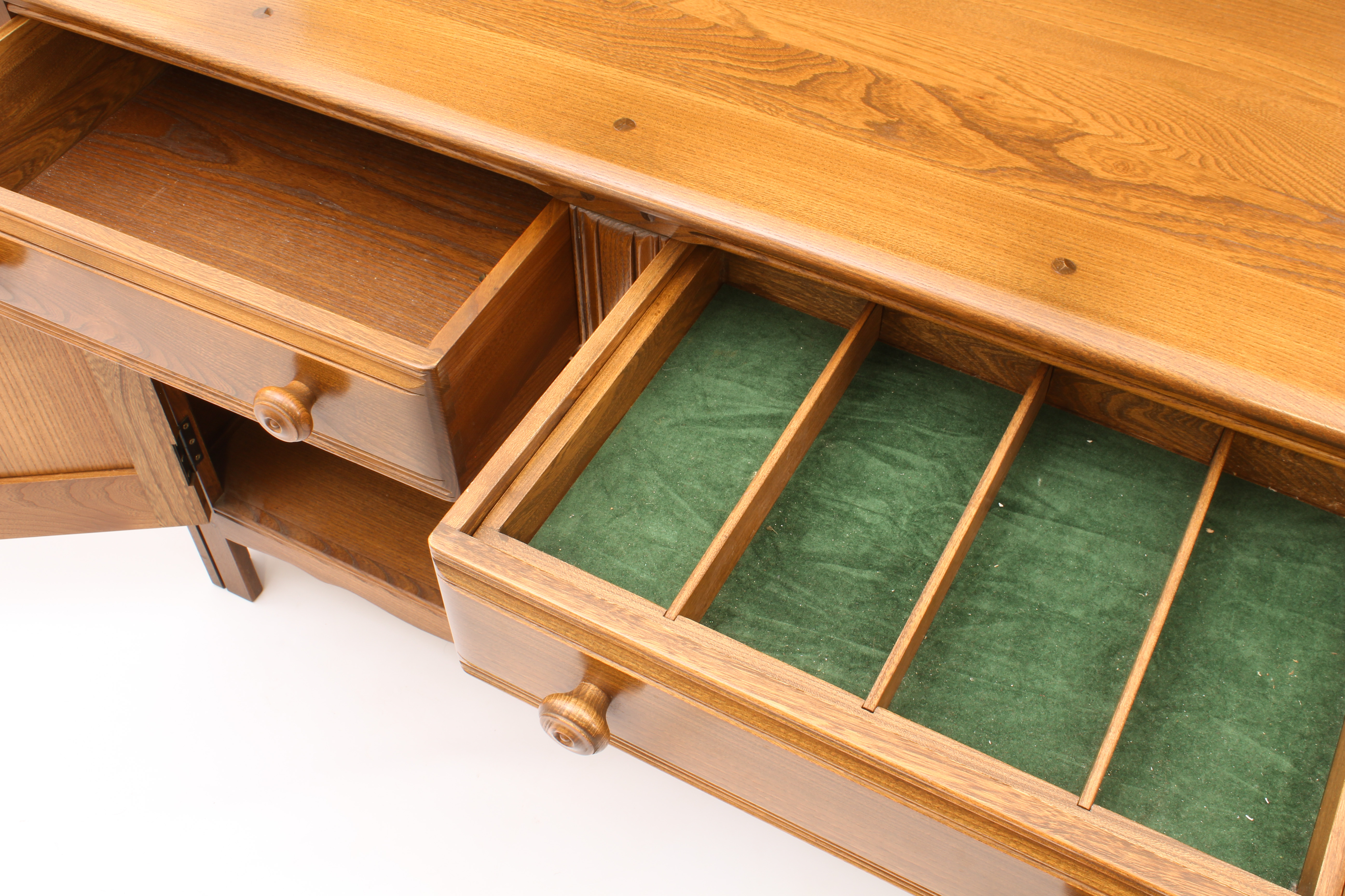 An Ercol Windsor elm dresser - the back with waterfall plate rack, over a base with two drawers (one - Image 7 of 8