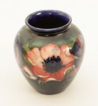 A Moorcroft ovoid vase in the 'Anemone' pattern - impressed factory mark with facsimile signature,