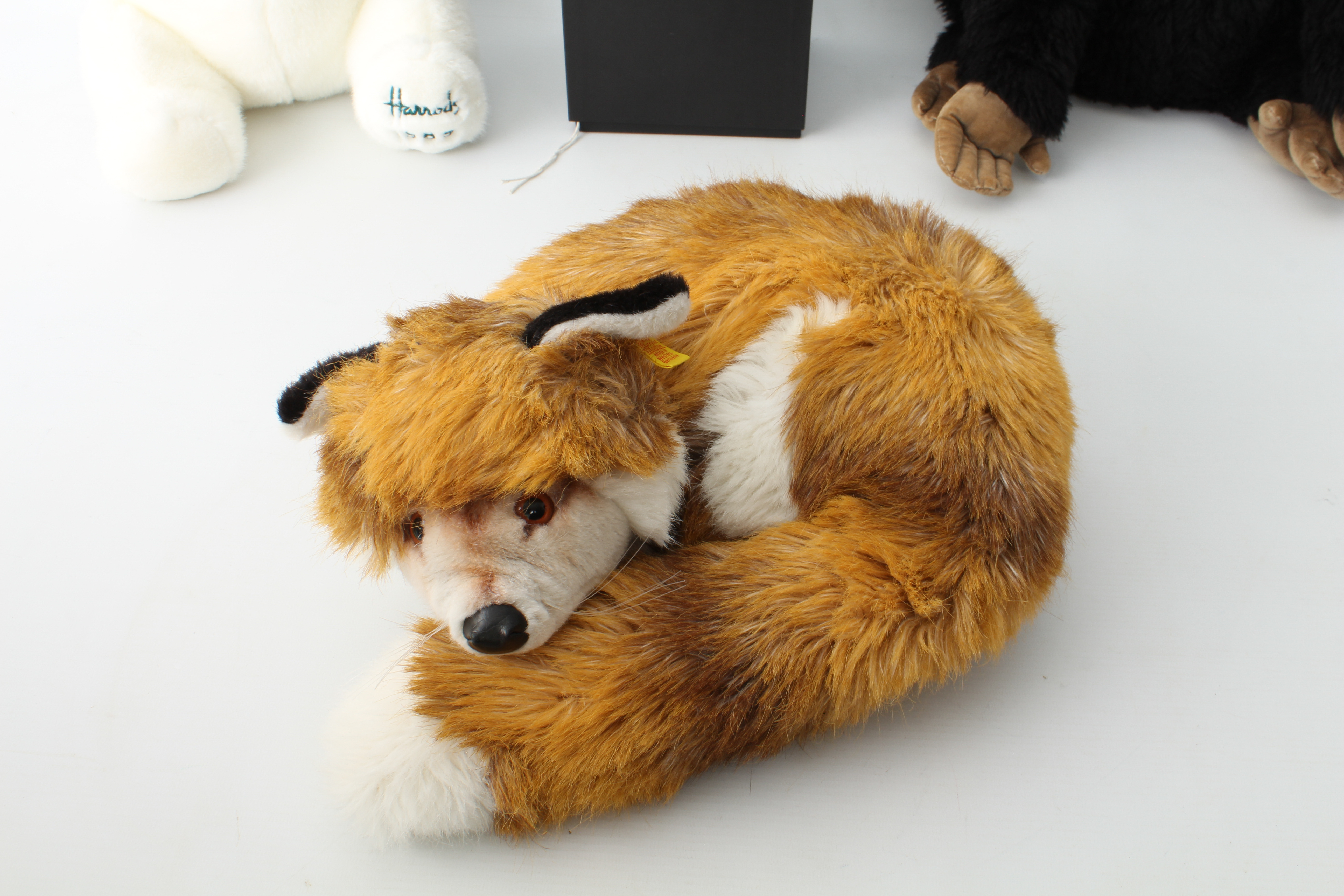 Two Steiff soft toys - comprising a sleeping fox (ref. 1542/35) and a seated panda (ref. 5357/25), - Image 2 of 5