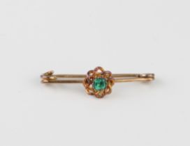 A 9ct yellow gold and emerald bar brooch - stamped 'PATENT 9CT', with a single square cut emerald