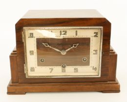 An Art Deco walnut chiming and quarter striking mantel clock - with step sided case, silvered Arabic