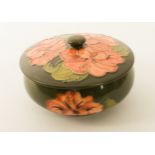 A Moorcroft 'Coral Hibiscus' pattern powder bowl - on a green ground, impressed factory marks, 14.