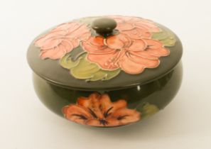 A Moorcroft 'Coral Hibiscus' pattern powder bowl - on a green ground, impressed factory marks, 14.