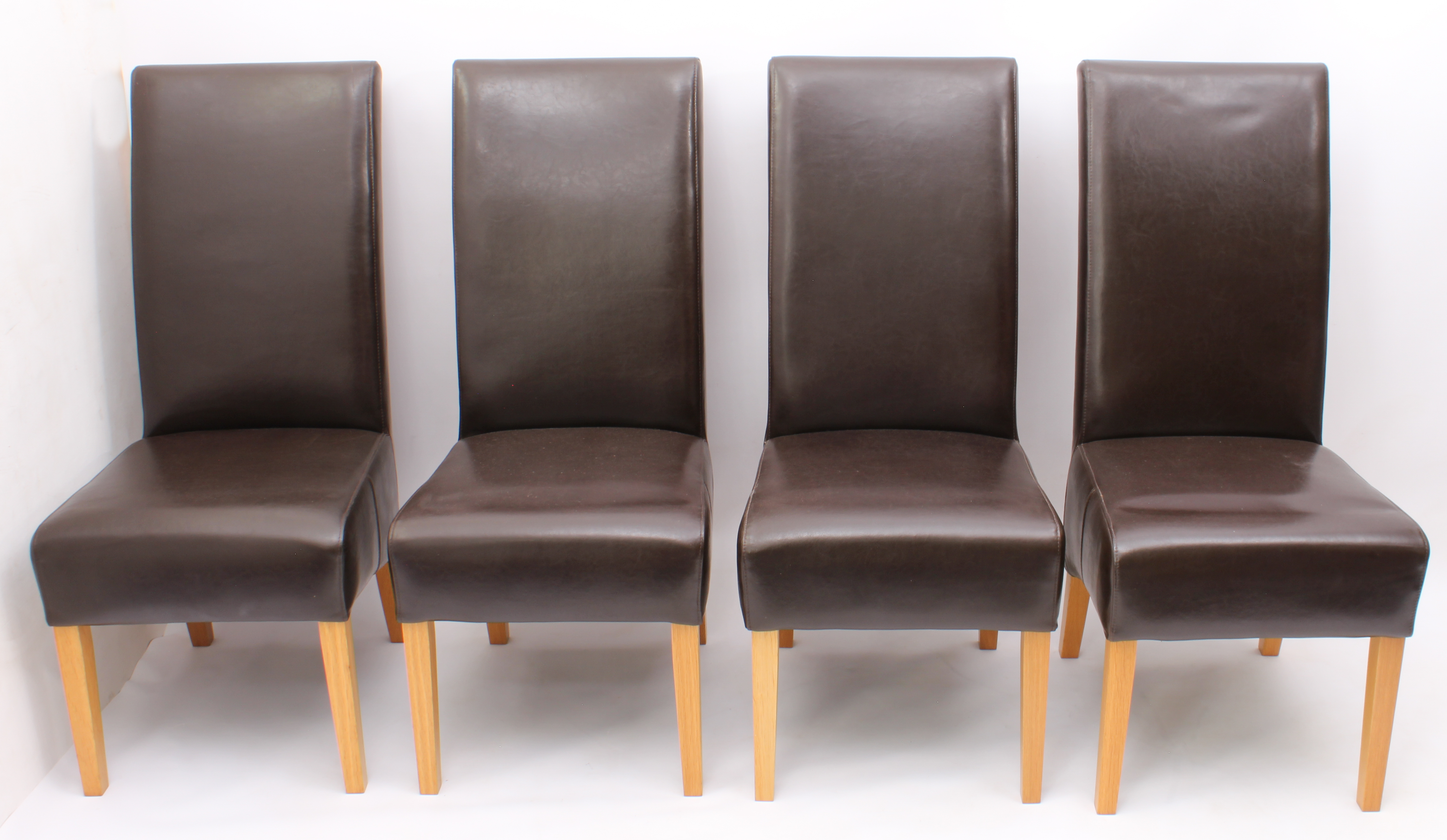 A set of four chocolate-brown leather and oak high-back dining chairs - modern, 48 cm wide, 108.5 cm