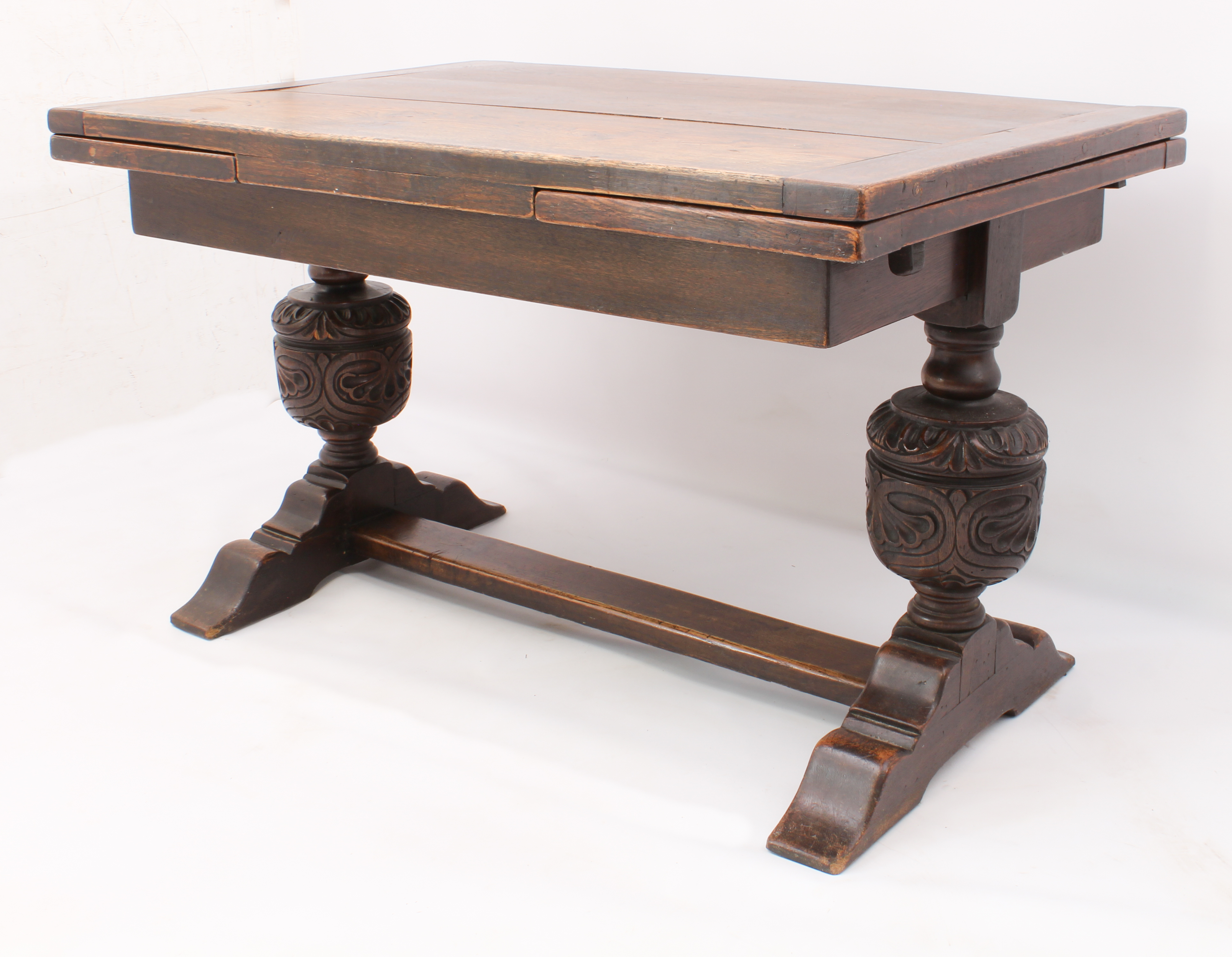 A carved oak extending refectory style dining table - the cleated, rectangular top with a single - Image 2 of 7