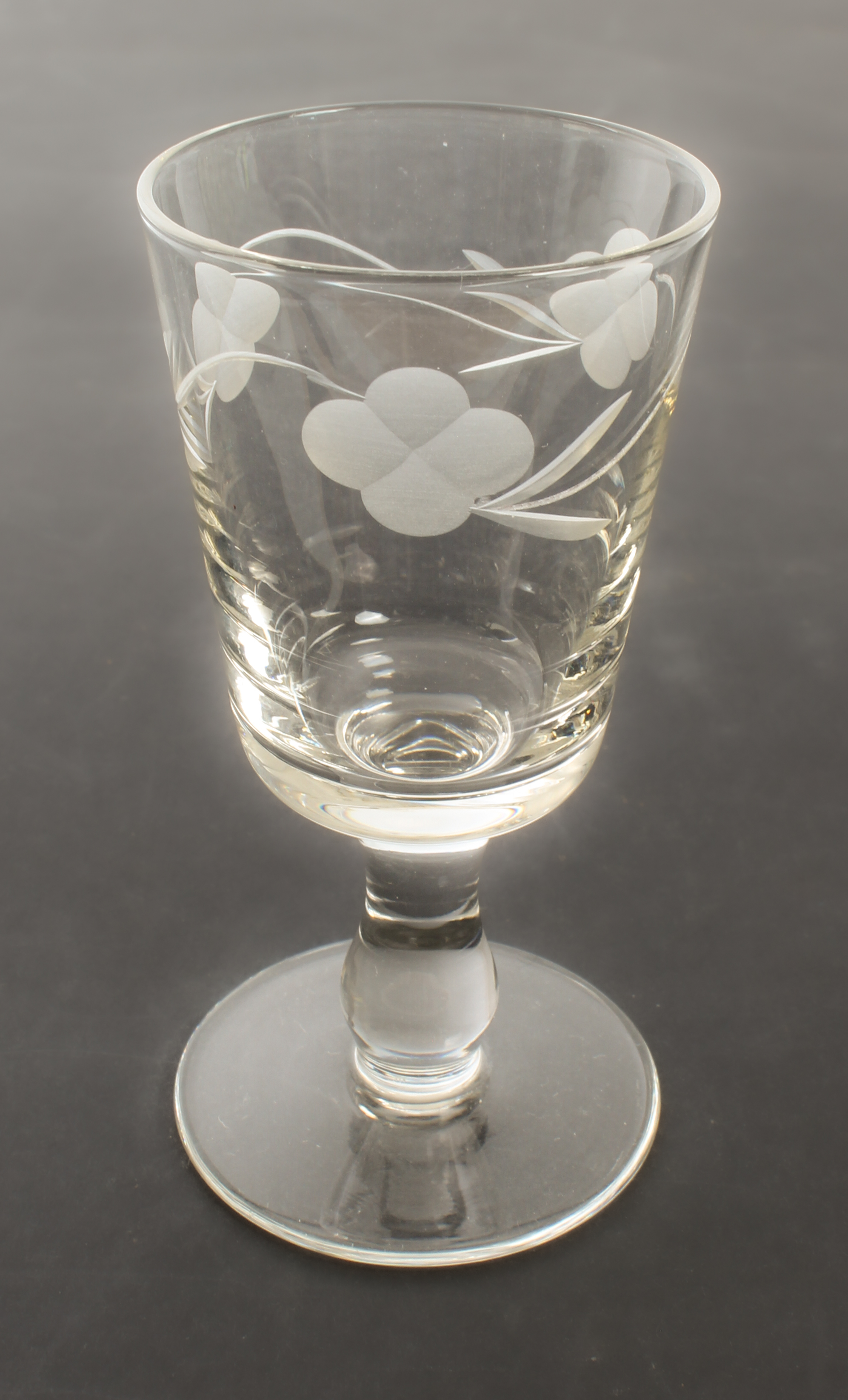 A set of twelve port glasses - 1950s-60s, the bucket bowls wheel-engraved with trailing flowers, - Image 2 of 2