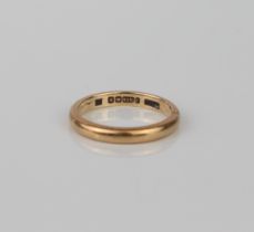 A 9ct yellow gold wedding band - hallmarked Birmingham 1947, size L.