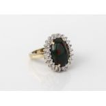 A 9ct yellow gold, bloodstone and white sapphire cluster ring - hallmarked Sheffield 2004, the large