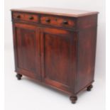 A Victorian mahogany side cabinet or chiffonier - the moulded top over two frieze drawers and a pair