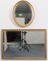 Two gilt framed mirrors - one oval, 53.5 x 46 cm; the other rectangular, 93 x 62 cm; both with