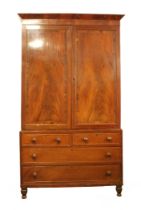 A mid-19th century mahogany and rosewood cross banded linen press - the flared cornice over a pair