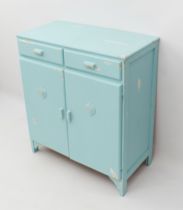 A mid-century side cabinet painted in retro style - with two drawers over a pair of cupboard