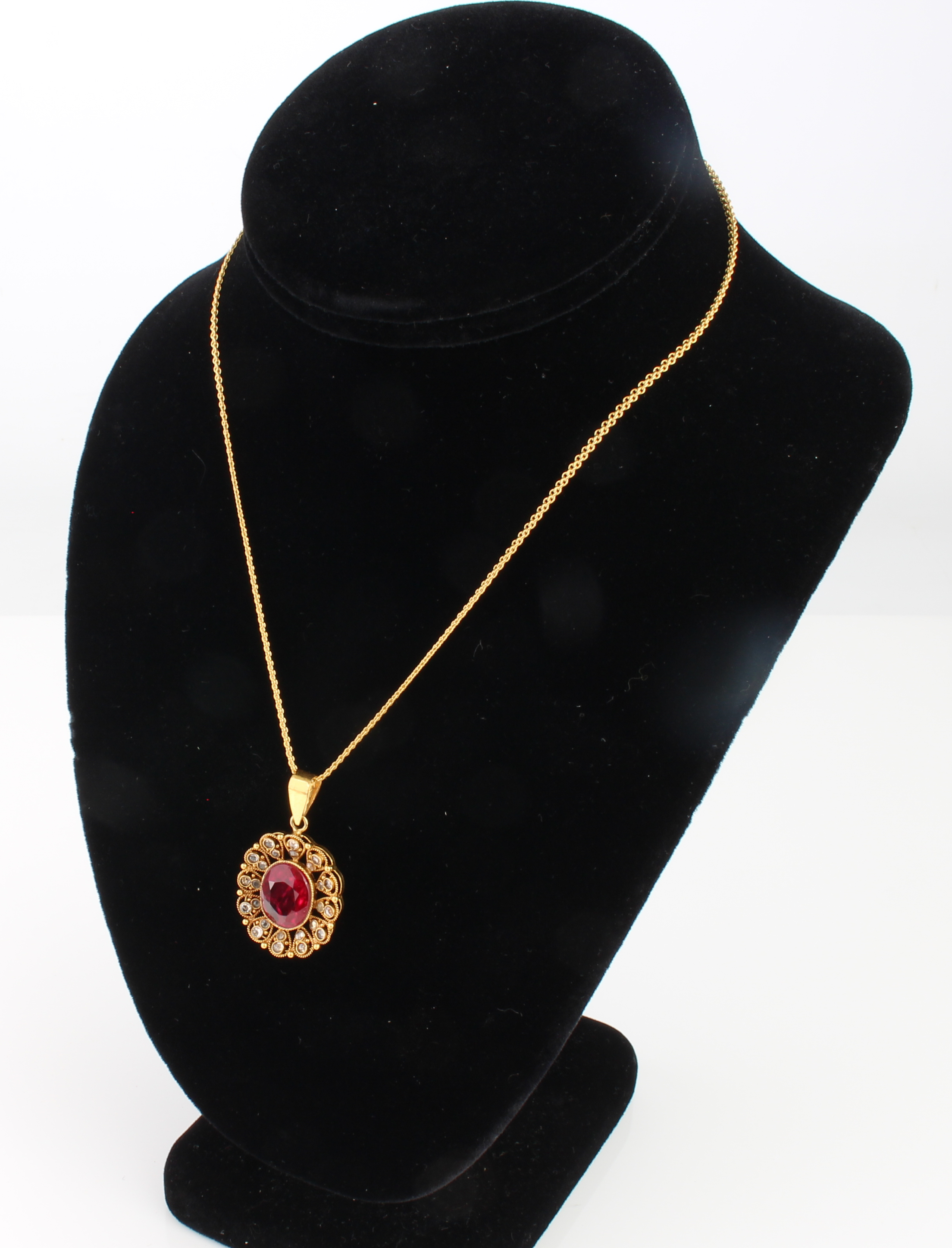 A 22ct gold, red stone and diamond cluster pendant necklace and earrings en suite - unmarked, - Image 4 of 5