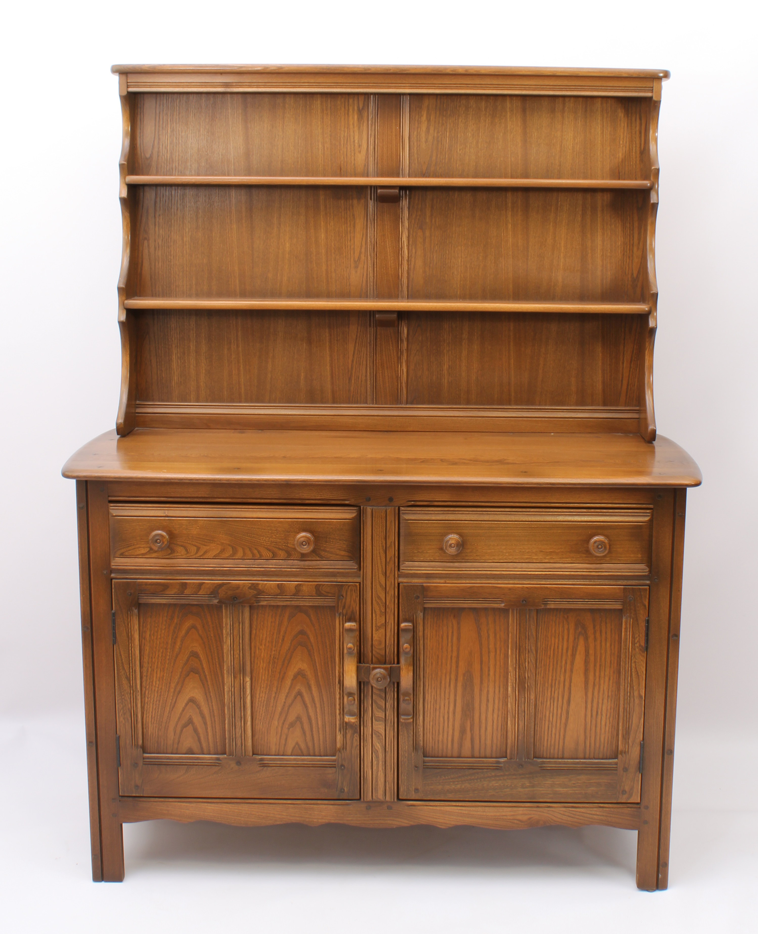 An Ercol Windsor elm dresser - the back with waterfall plate rack, over a base with two drawers (one - Image 2 of 8