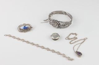 A small group of silver and white metal jewellery - including a silver and amethyst pendant