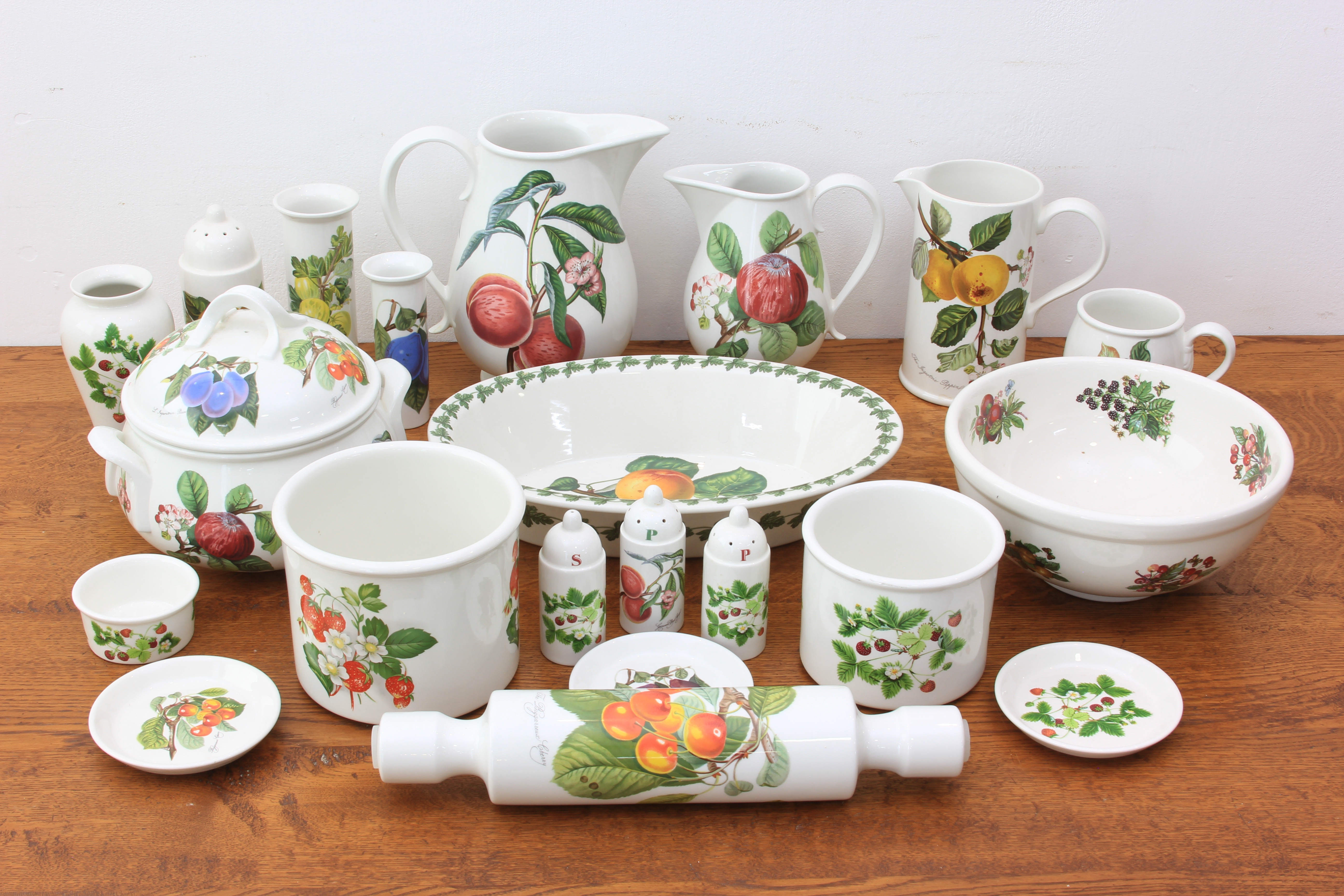 A collection of Portmeirion Pomona and other fruit pattern dinner and oven to table ware - including