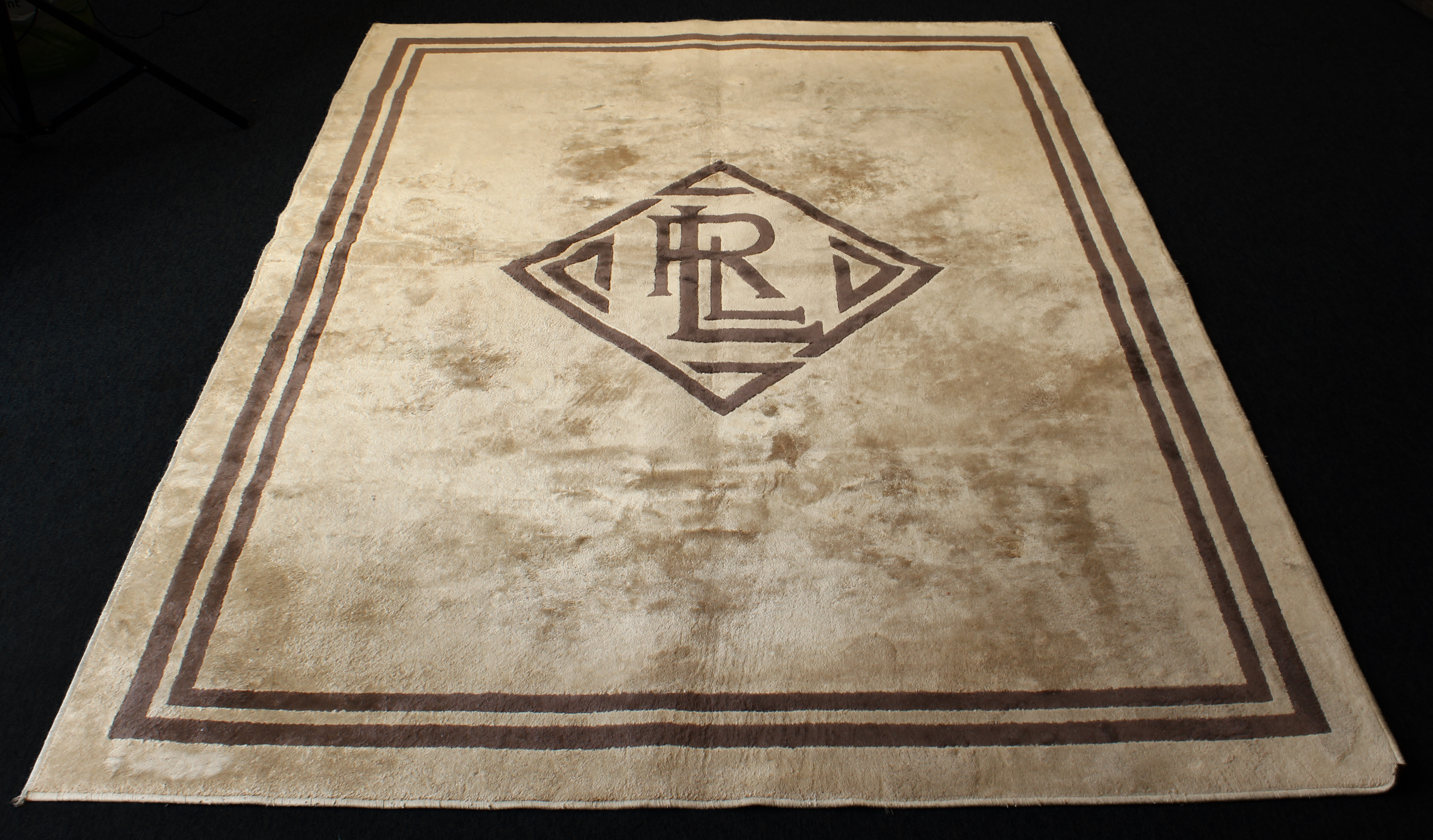 A Ralph Lauren monogram rug - probably silk and wool, original RL label to border, in chocolate